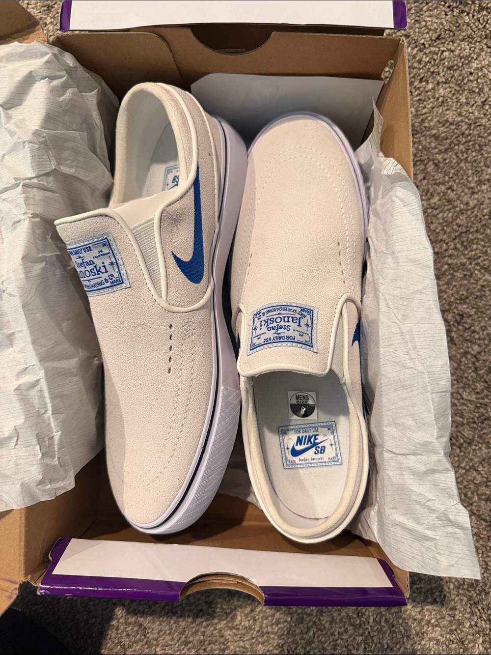 Nike Slip-On Sneakers in Off-White with Blue Swoosh